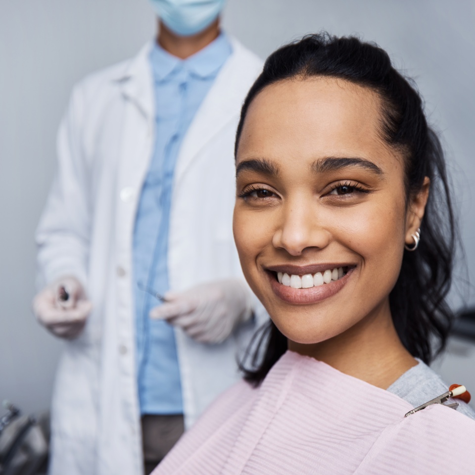 Portrait of a young woman having dental work done on her teeth.